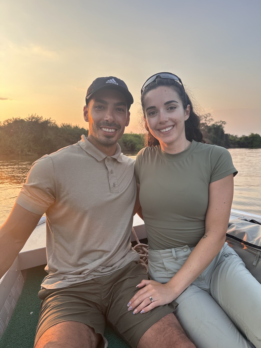 Alireza Hemadani and Roxy the Zoologist on a boat at sunset in the Pantanal, Brazil